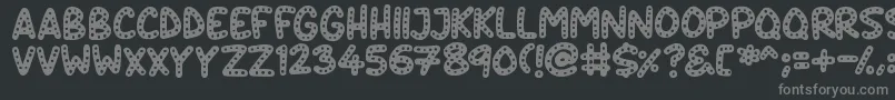 Crazy Dots-fontti – harmaat kirjasimet mustalla taustalla