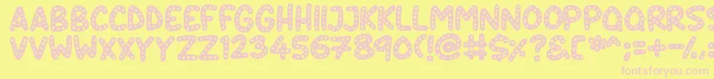 Crazy Dots-fontti – vaaleanpunaiset fontit keltaisella taustalla
