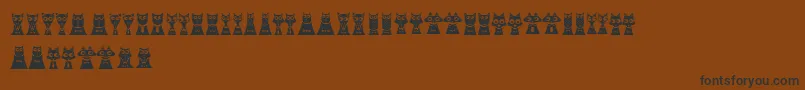Шрифт CreatureswithHorns – чёрные шрифты на коричневом фоне