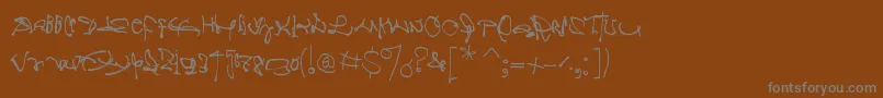 Crazywritten-fontti – harmaat kirjasimet ruskealla taustalla