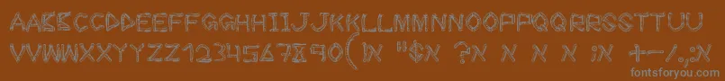 Czcionka WoodSticks – szare czcionki na brązowym tle