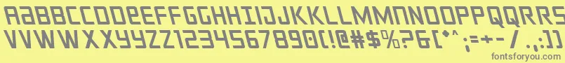 フォントcrixusleft – 黄色の背景に灰色の文字