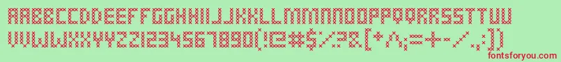 CrossStitched-Schriftart – Rote Schriften auf grünem Hintergrund