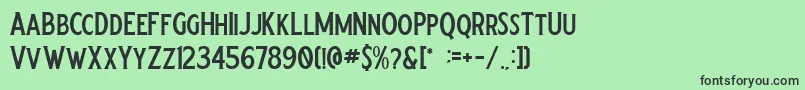 Crumble Regular-fontti – mustat fontit vihreällä taustalla
