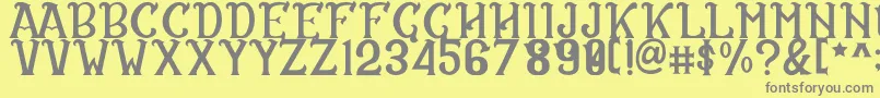 フォントCS Rosalia Regular – 黄色の背景に灰色の文字