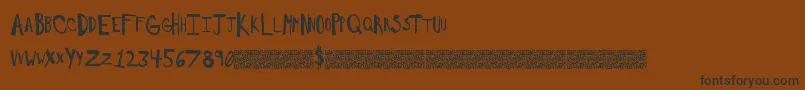 Saltywould-Schriftart – Schwarze Schriften auf braunem Hintergrund