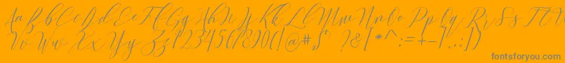 Culture-Schriftart – Graue Schriften auf orangefarbenem Hintergrund