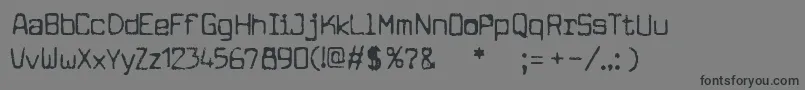 フォントcuomotype – 黒い文字の灰色の背景
