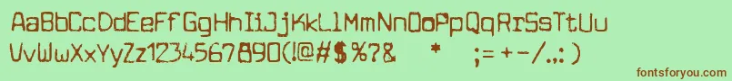 フォントcuomotype – 緑の背景に茶色のフォント
