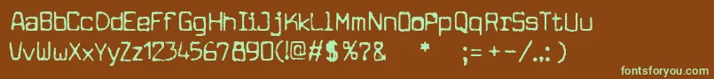 フォントcuomotype – 緑色の文字が茶色の背景にあります。