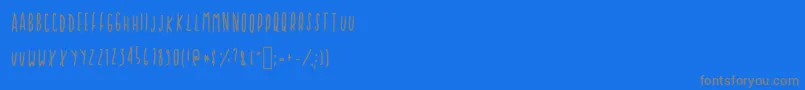 フォントCupcakie – 青い背景に灰色の文字