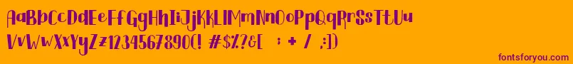 Czcionka Curtina Font – fioletowe czcionki na pomarańczowym tle