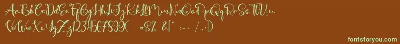 フォントCute Thing Script – 緑色の文字が茶色の背景にあります。