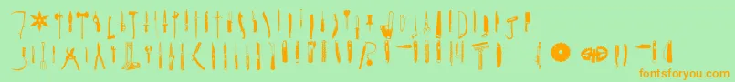 フォントcutpoint 3 1 – オレンジの文字が緑の背景にあります。