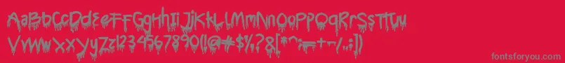 CyttahSplatter-Schriftart – Graue Schriften auf rotem Hintergrund