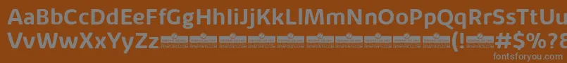 KabrioAlternateBoldTrial-fontti – harmaat kirjasimet ruskealla taustalla
