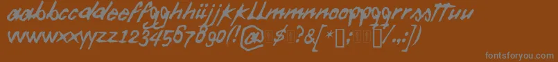 Więcej informacji o czcionce Daft Font Czcionka Daft Font – szare czcionki na brązowym tle