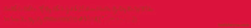 dahlia script-Schriftart – Braune Schriften auf rotem Hintergrund