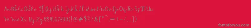 フォントdahlia script – 赤い背景に灰色の文字