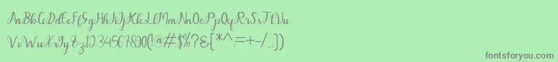 フォントDahlia – 緑の背景に灰色の文字