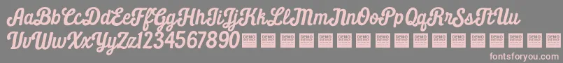 Daily Grind   Demo-Schriftart – Rosa Schriften auf grauem Hintergrund