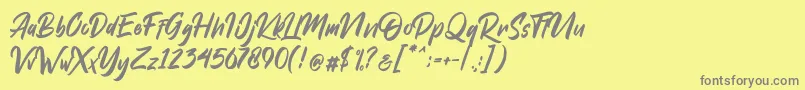 Dakwart Letter-fontti – harmaat kirjasimet keltaisella taustalla