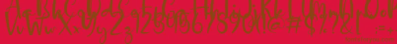 フォントDalillah Demo – 赤い背景に茶色の文字