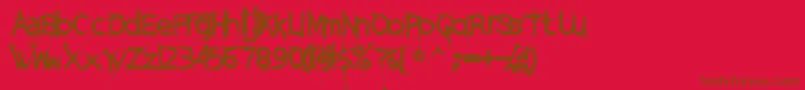 Fonte DamagedSataLightExtended – fontes marrons em um fundo vermelho