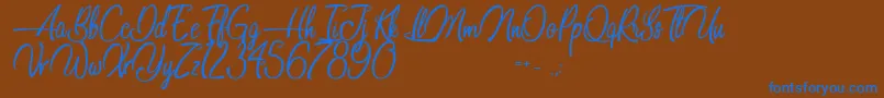 Dancing in the Beat Font – Blue Fonts on Brown Background