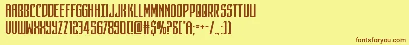 フォントdarkdominion – 茶色の文字が黄色の背景にあります。