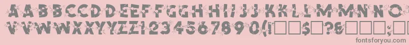 SpencerRegular-fontti – harmaat kirjasimet vaaleanpunaisella taustalla