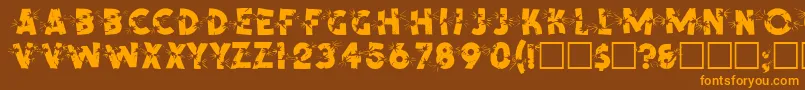 フォントSpencerRegular – オレンジ色の文字が茶色の背景にあります。