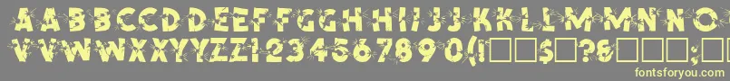 SpencerRegular-Schriftart – Gelbe Schriften auf grauem Hintergrund