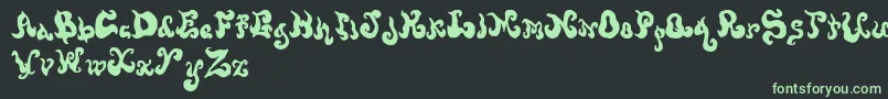 フォントScrewy – 黒い背景に緑の文字