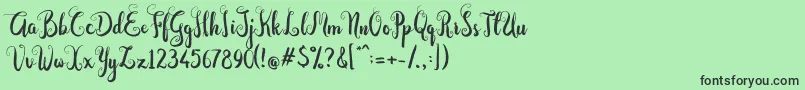 フォントDastan Script – 緑の背景に黒い文字