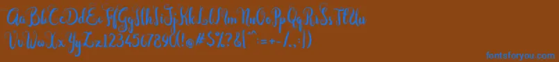 フォントDastan Script – 茶色の背景に青い文字