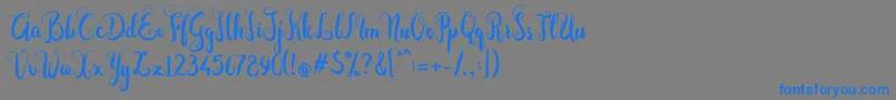 Czcionka Dastan Script – niebieskie czcionki na szarym tle