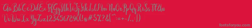 Czcionka Dastan Script – szare czcionki na czerwonym tle
