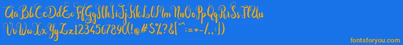 フォントDastan Script – オレンジ色の文字が青い背景にあります。