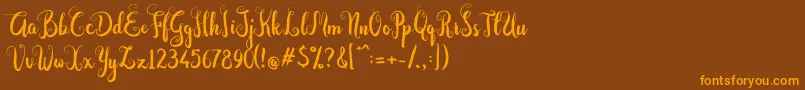 Dastan Script-Schriftart – Orangefarbene Schriften auf braunem Hintergrund