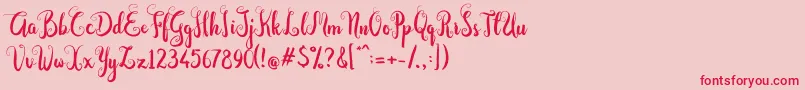 Dastan Script-fontti – punaiset fontit vaaleanpunaisella taustalla