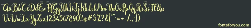 Шрифт Dastan Script – жёлтые шрифты на чёрном фоне