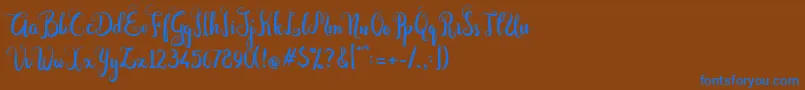Dastan Script-fontti – siniset fontit ruskealla taustalla