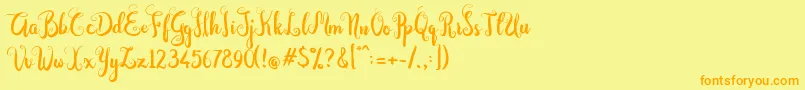 Fonte Dastan Script – fontes laranjas em um fundo amarelo