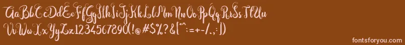 Fonte Dastan Script – fontes rosa em um fundo marrom