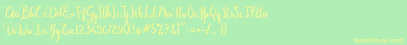 フォントDastan Script – 黄色の文字が緑の背景にあります