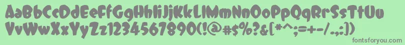 DCC   Dreamer-fontti – harmaat kirjasimet vihreällä taustalla