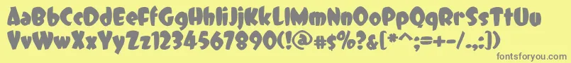 DCC   Dreamer-fontti – harmaat kirjasimet keltaisella taustalla