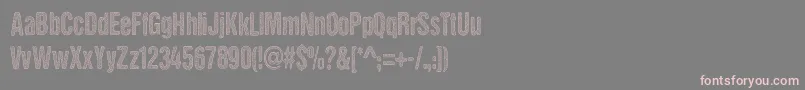 フォントDCC   Stained Aliens – 灰色の背景にピンクのフォント