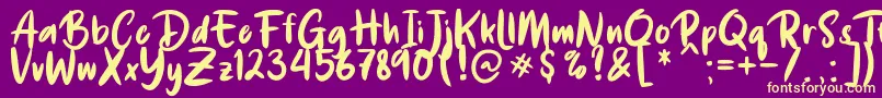 De Luxious Font – Yellow Fonts on Purple Background